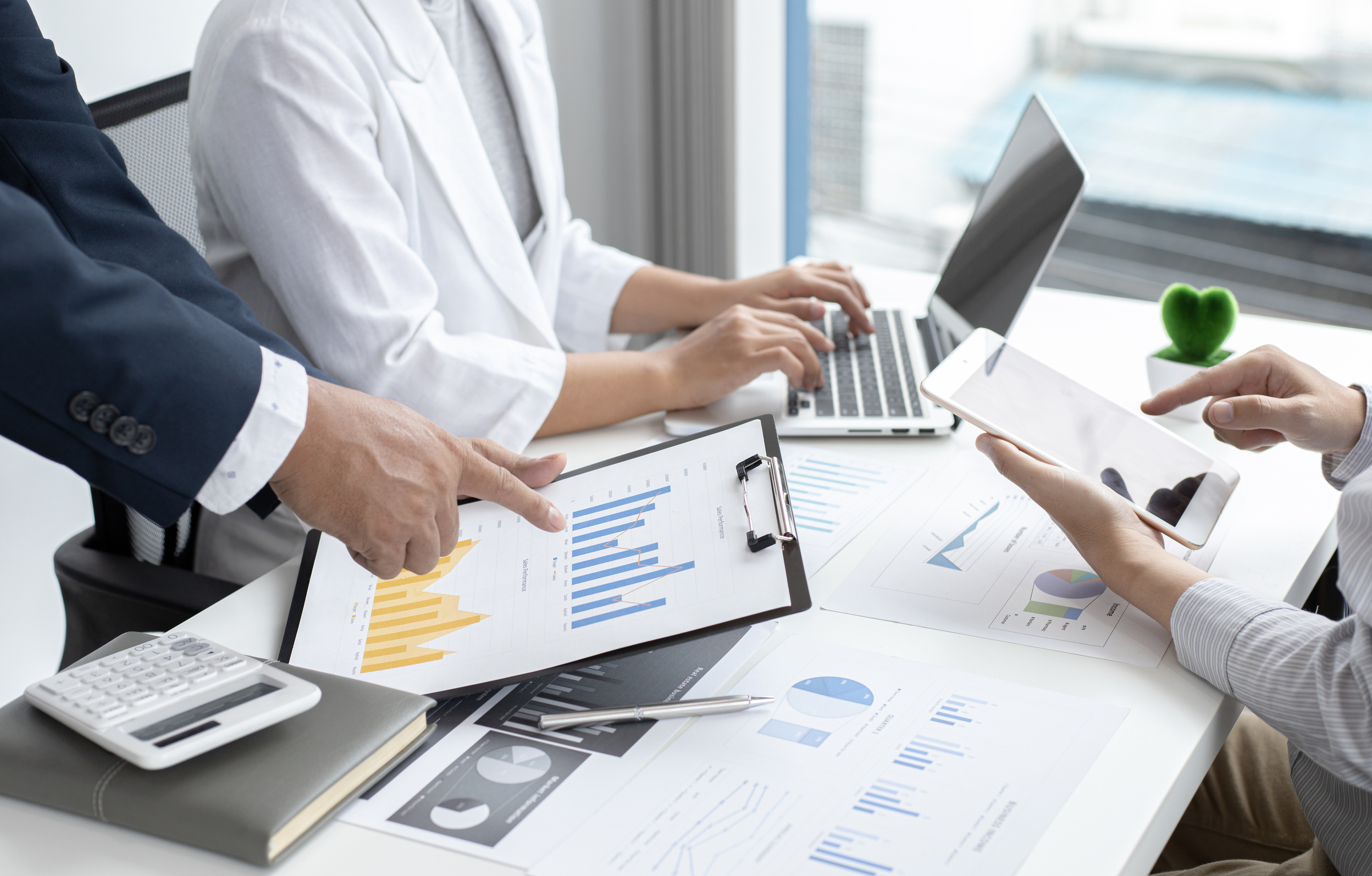 Business Team Meeting and Data Presentation